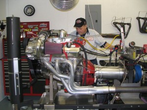 Dean is preparing to pull this supercharged 900 horse power small block Chevy engine on our 901 Super Flow dyno. All of our high performance engines are run on our dyno to ensure maximum performance is realized.